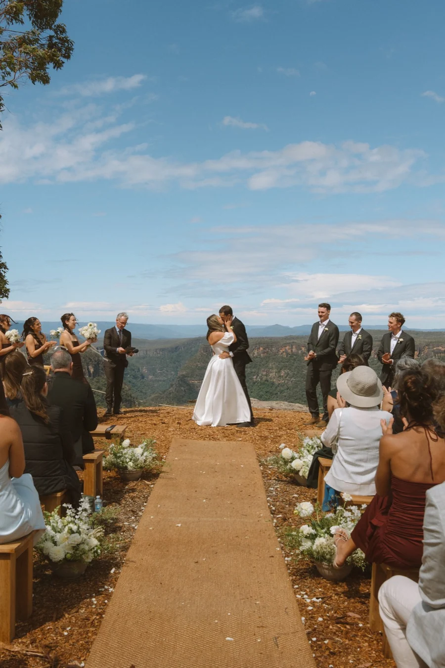 Caoura Cliffs &mdash; a ceremony aisle with guests seated