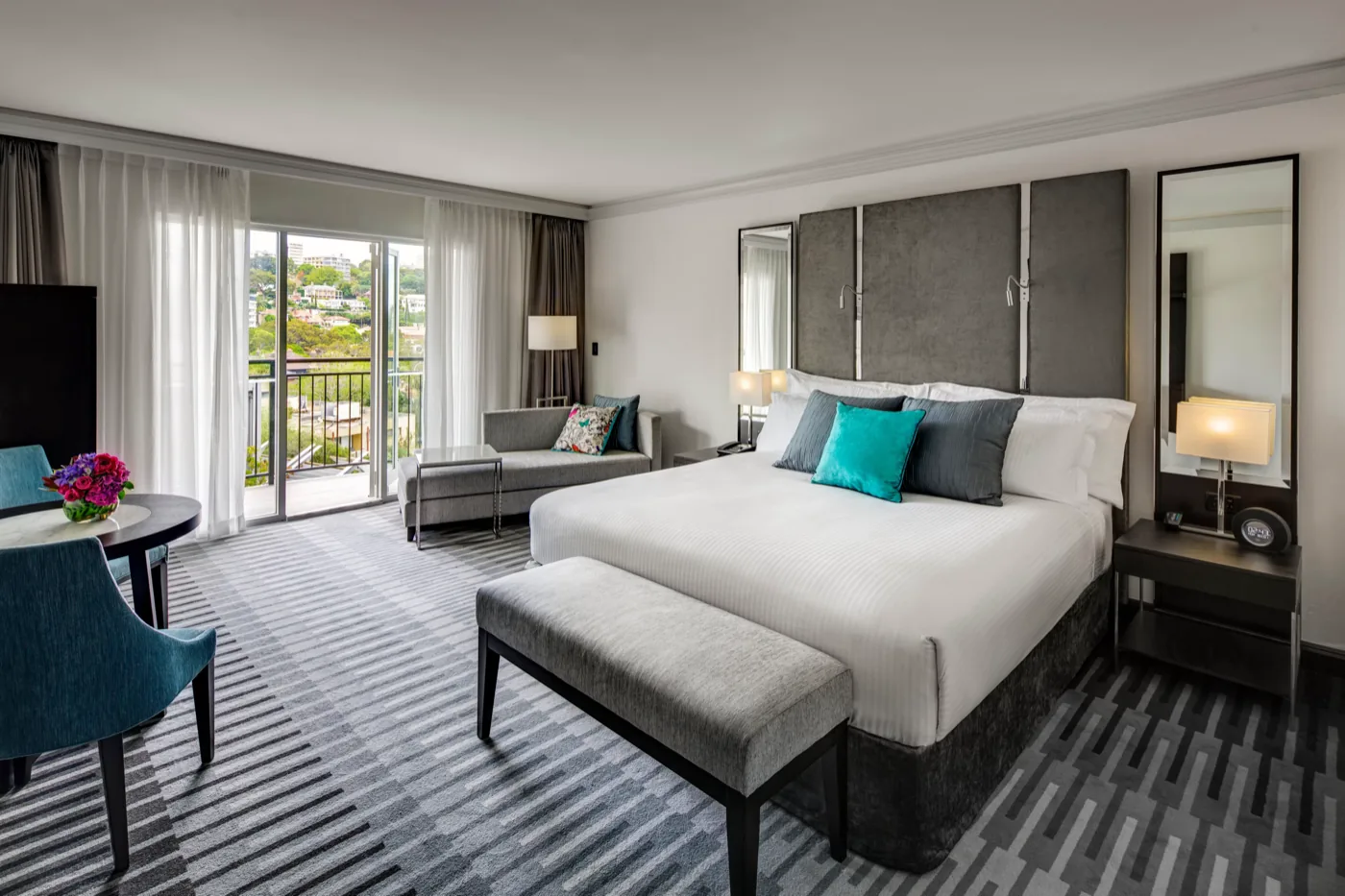 Guest room with king bed and private balcony at InterContinental Sydney Double Bay