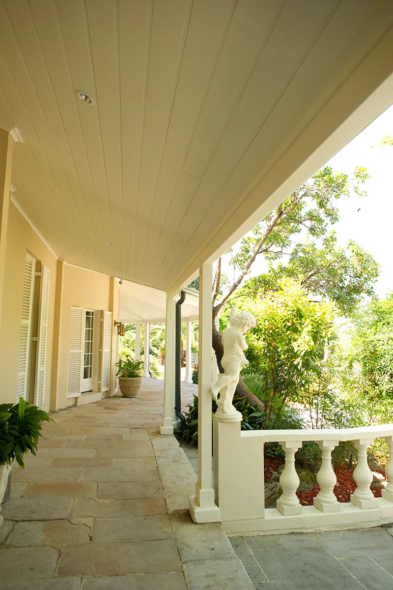 Heritage colonnade and urns in the gardens at Oatlands Estate