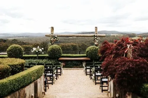 The terraced garden ceremony setting at Forest Edge