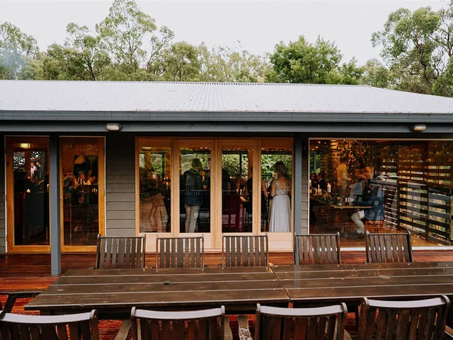 The timber deck and wedding building surrounded by bush