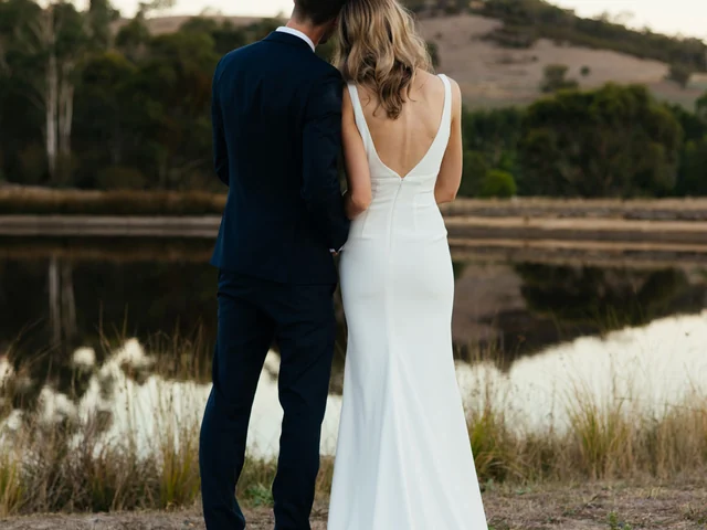 Newlyweds at the edge of the wetlands at dusk