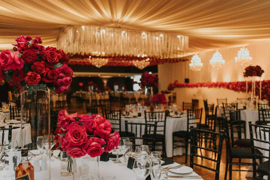 Celebrating In Style &mdash; a reception room styled in deep red and pink blooms