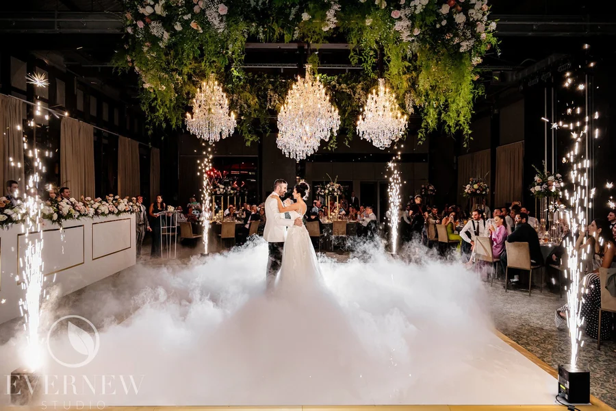Celebrating In Style &mdash; a draped ceremony space with suspended florals