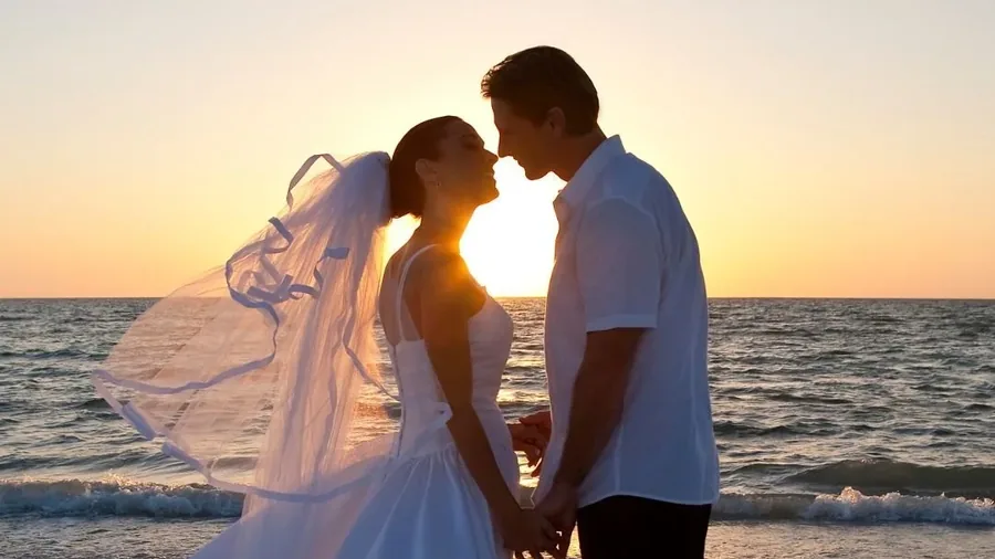 Beach ceremony setting at Elysian Retreat, on the private cove at the water&rsquo;s edge