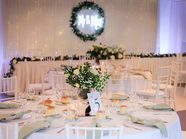 In The Grove — inside the all-weather marquee set with round tables