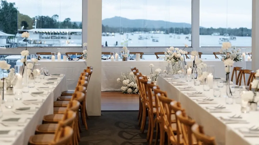 The River Room at Noosa Boathouse, set for a seated wedding reception overlooking the river