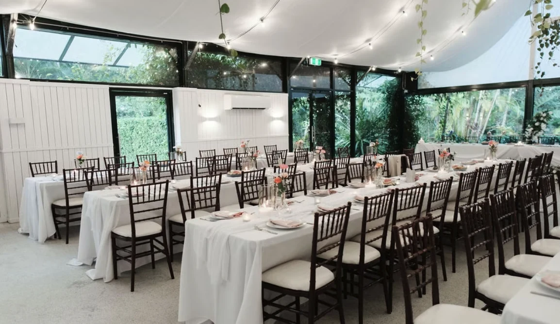 The glass pavilion set for a reception at Sol Gardens