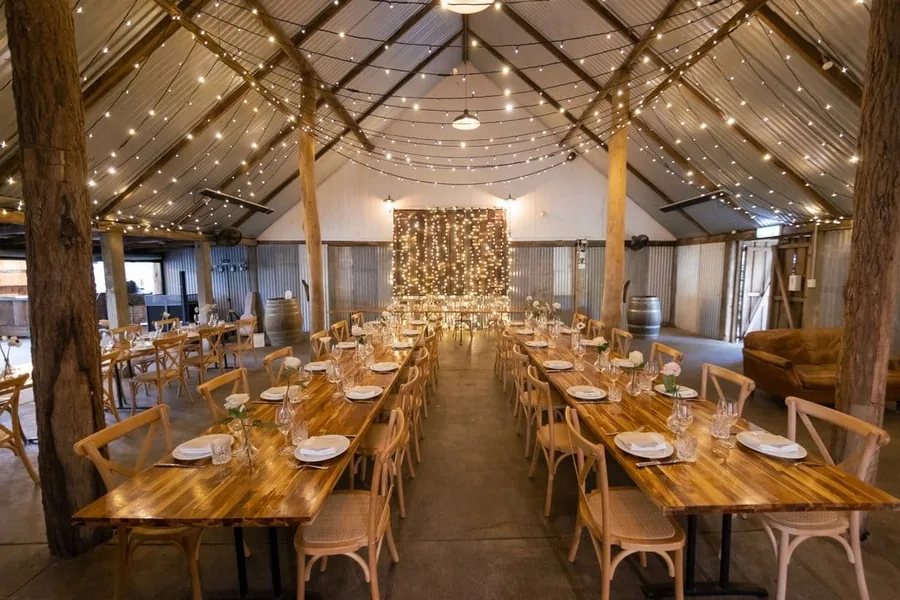 The restored 1902 barn at The Acre Boomerang Hills, set for a wedding reception