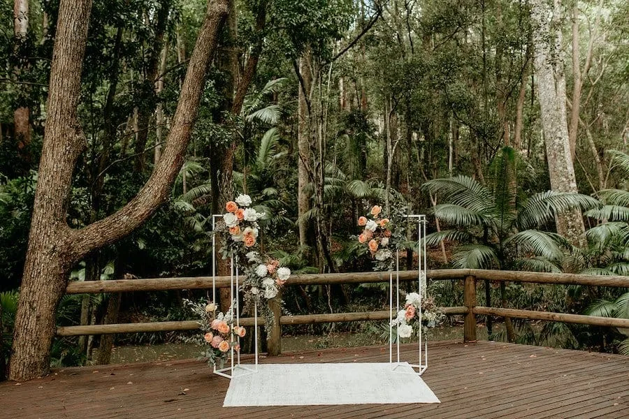 The Rainforest Deck at The Acre Boomerang Hills, a ceremony setting beside a gentle stream