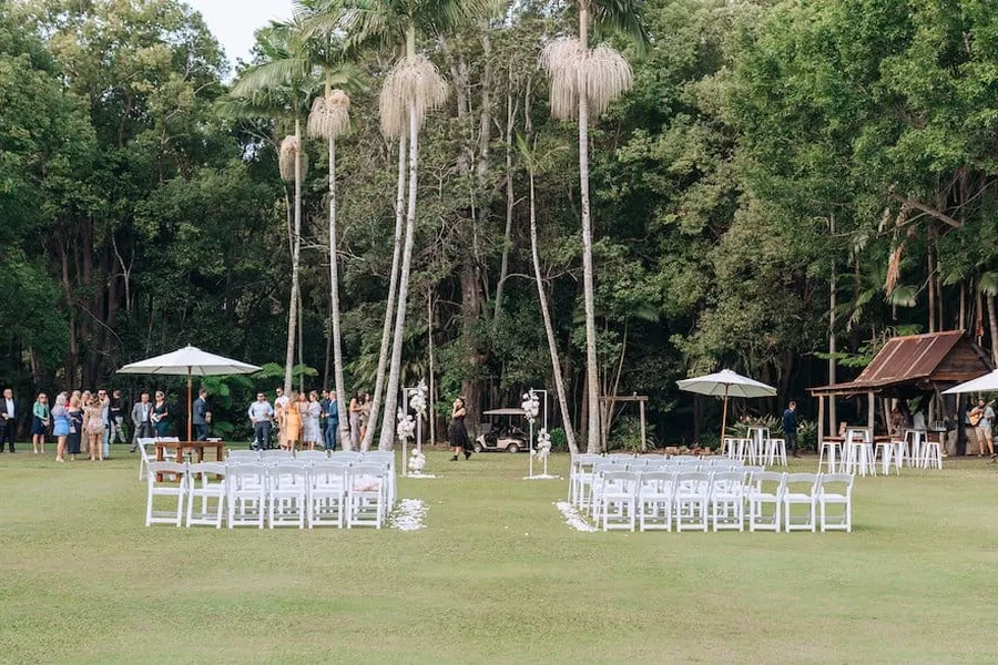 The Ceremony Lawn at The Acre Boomerang Hills, framed by sky-high palm trees