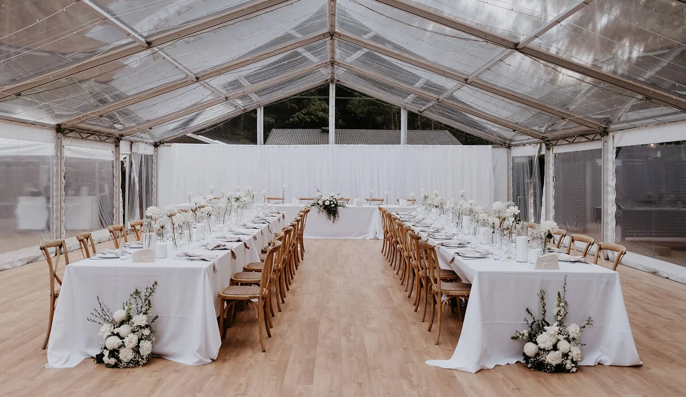 Clear marquee set for a seated reception at The Bower Estate