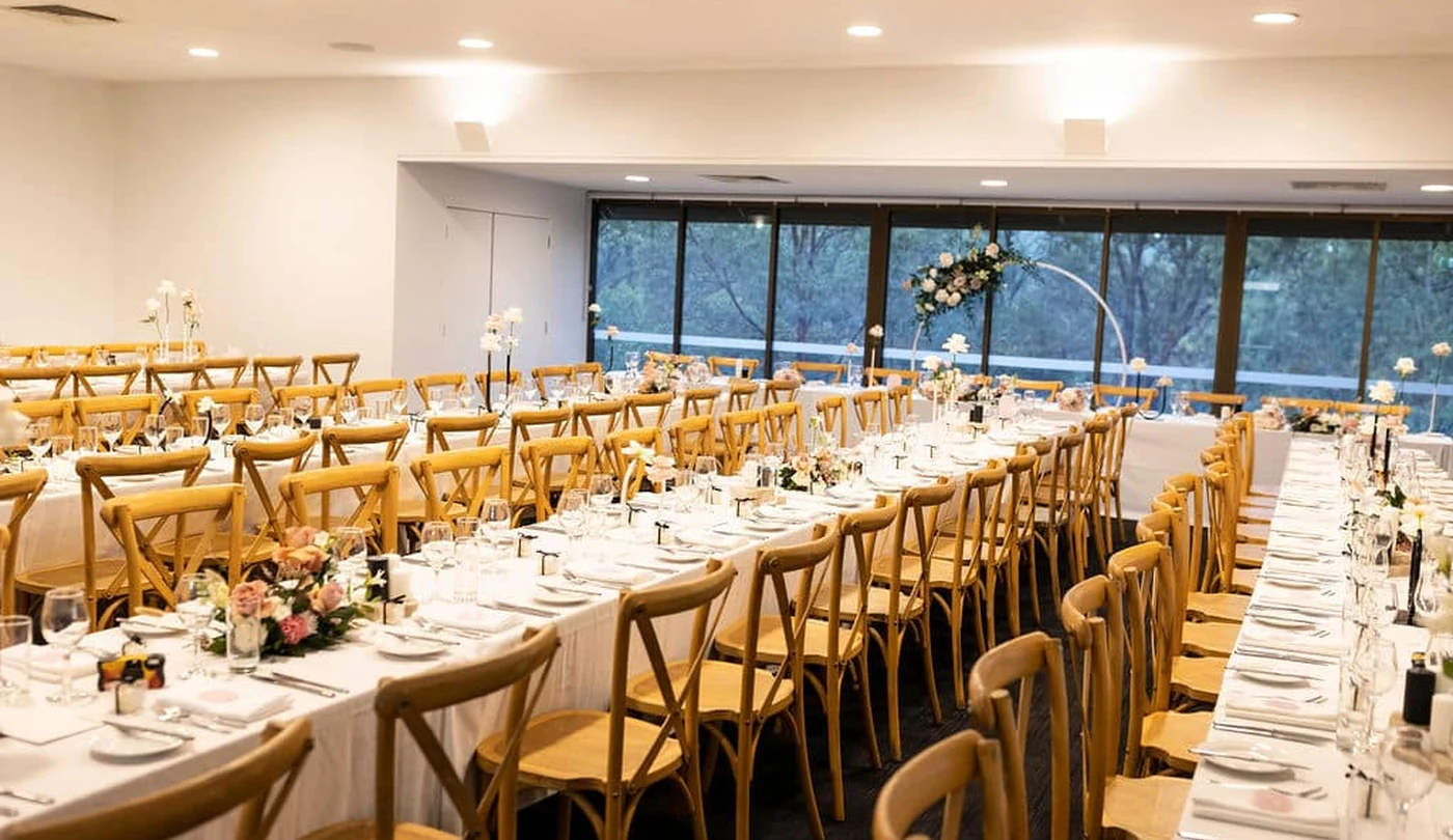 Banksia Room set for a wedding reception beside the glass wall at Walkabout Creek