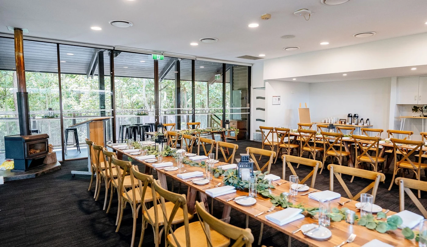Ferntree Room with its working fireplace and long timber table at Walkabout Creek