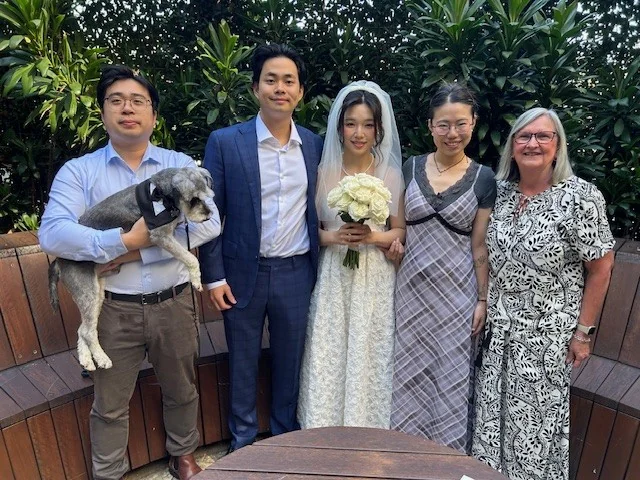 Margaret Janz with a newly married couple and their guests