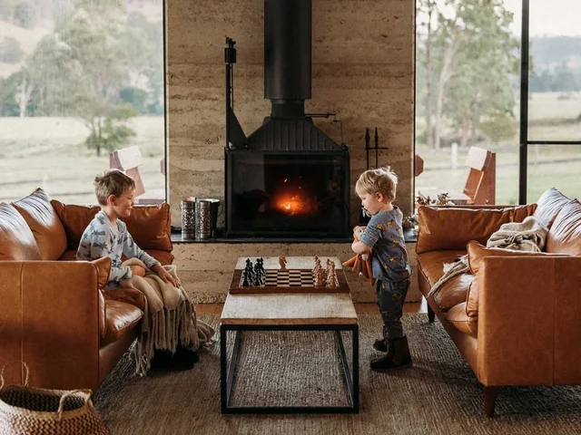 The living room of the farmhouse at Wallaringa Farm, with its wood fireplace
