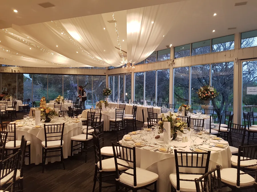 Adelaide Pavilion — round tables set beneath the draped ceiling