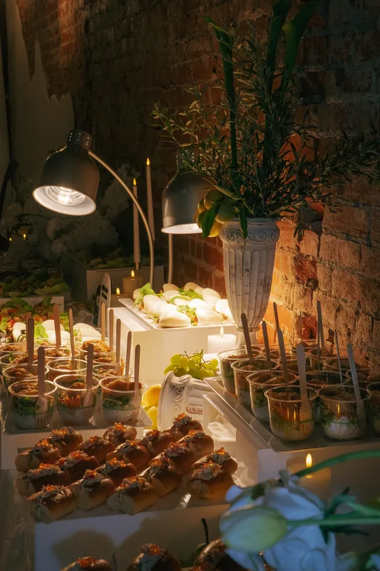 Coco NB &mdash; canapes and a grazing display under warm light