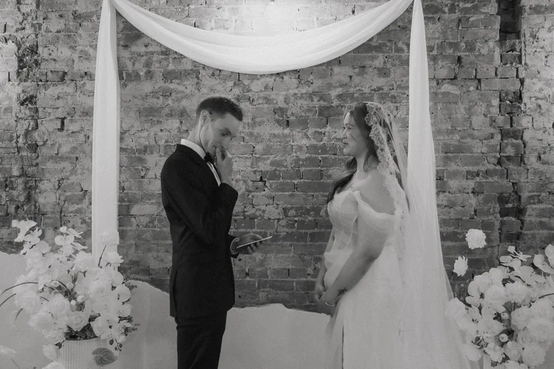 Coco NB &mdash; the couple at the floral backdrop