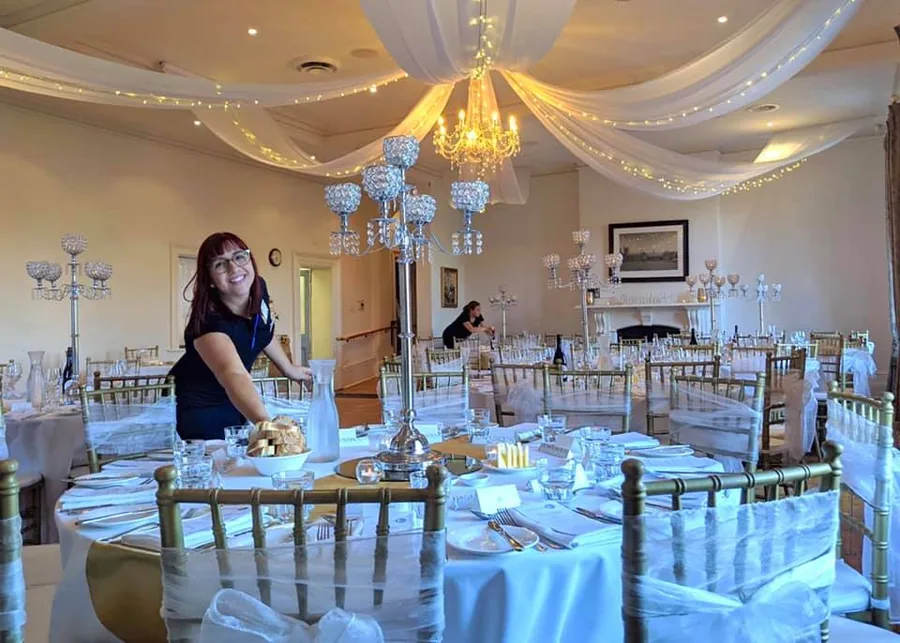 Glanville Hall &mdash; the ballroom with chandelier and draping
