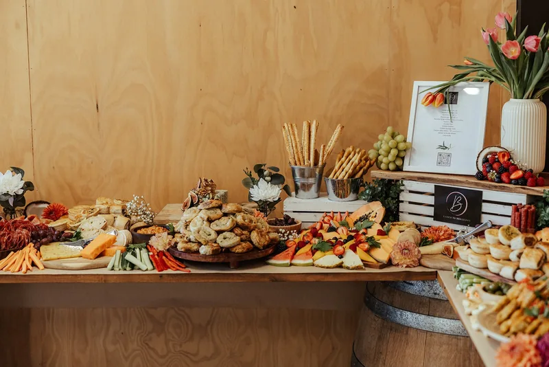 Hastwell & Lightfoot — a grazing table set against the wine barrels