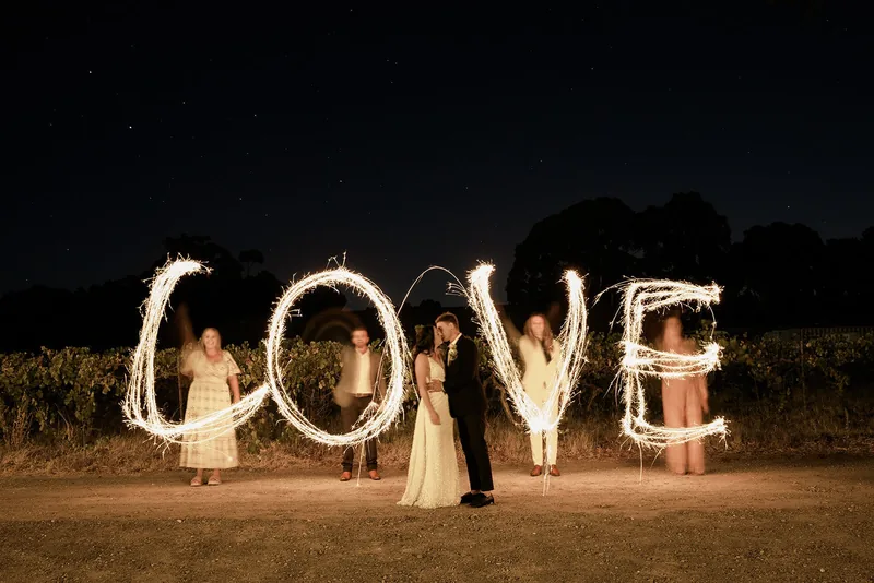 Hastwell & Lightfoot — sparkler letters spelling LOVE after dark