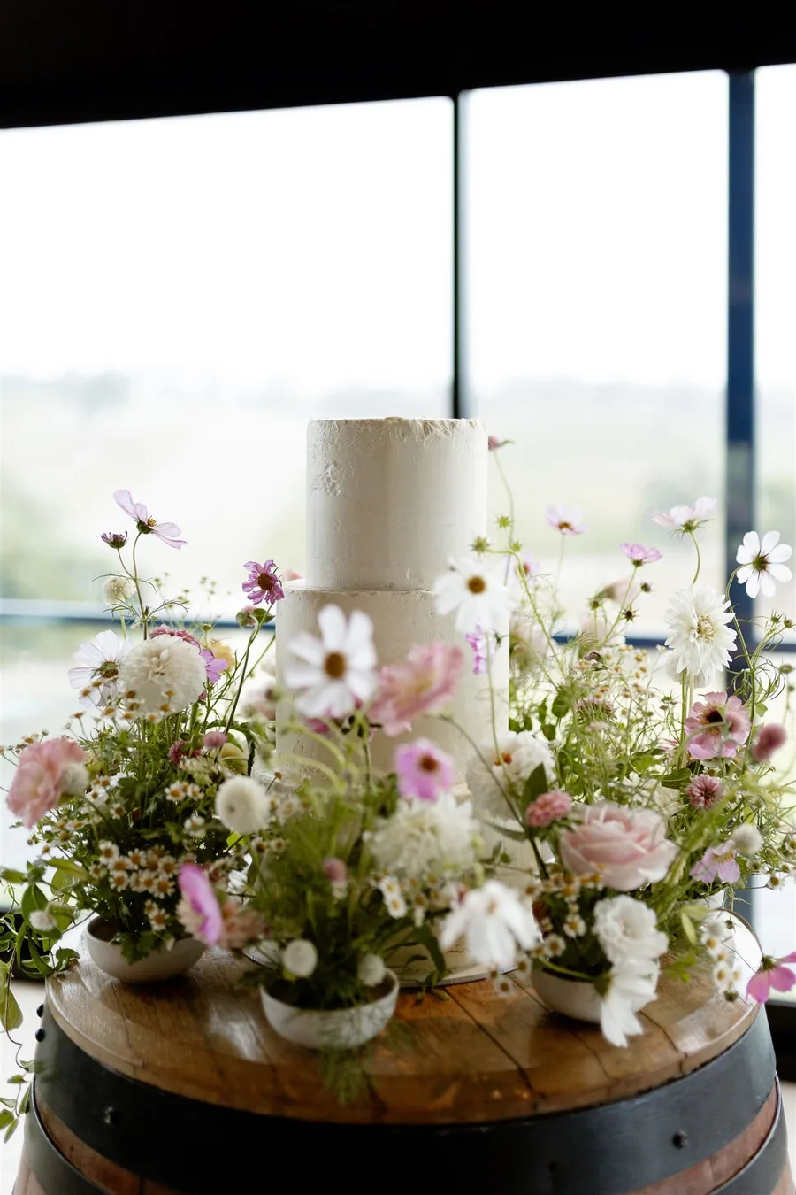 Longview Vineyard &mdash; florals and the cake on a wine barrel