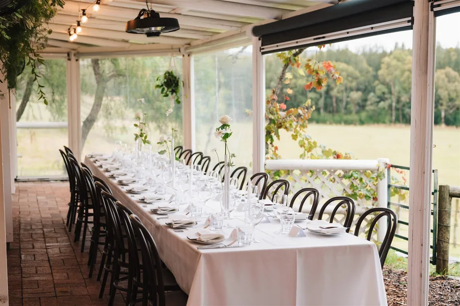Lost Phoenix Farm &mdash; a long table under the verandah
