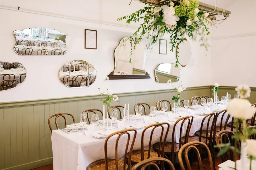 Lost Phoenix Farm &mdash; a long table dressed with greenery
