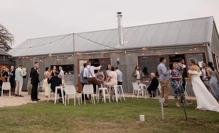Tilbrook Estate &mdash; guests on the lawn outside the cellar door under festoon lights