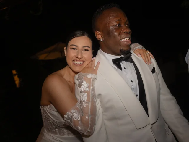 Bride and groom celebrating at their evening wedding reception