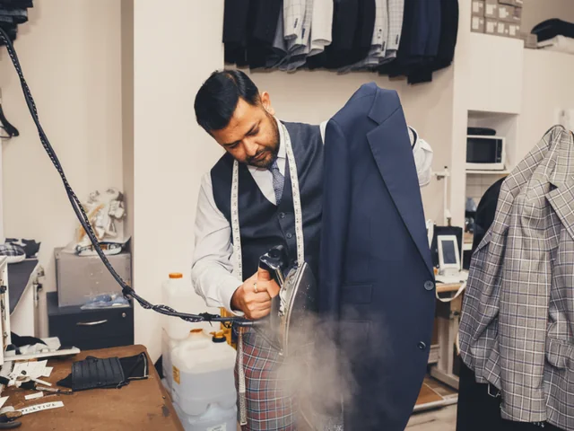 Steaming a jacket in the LaMilago workroom