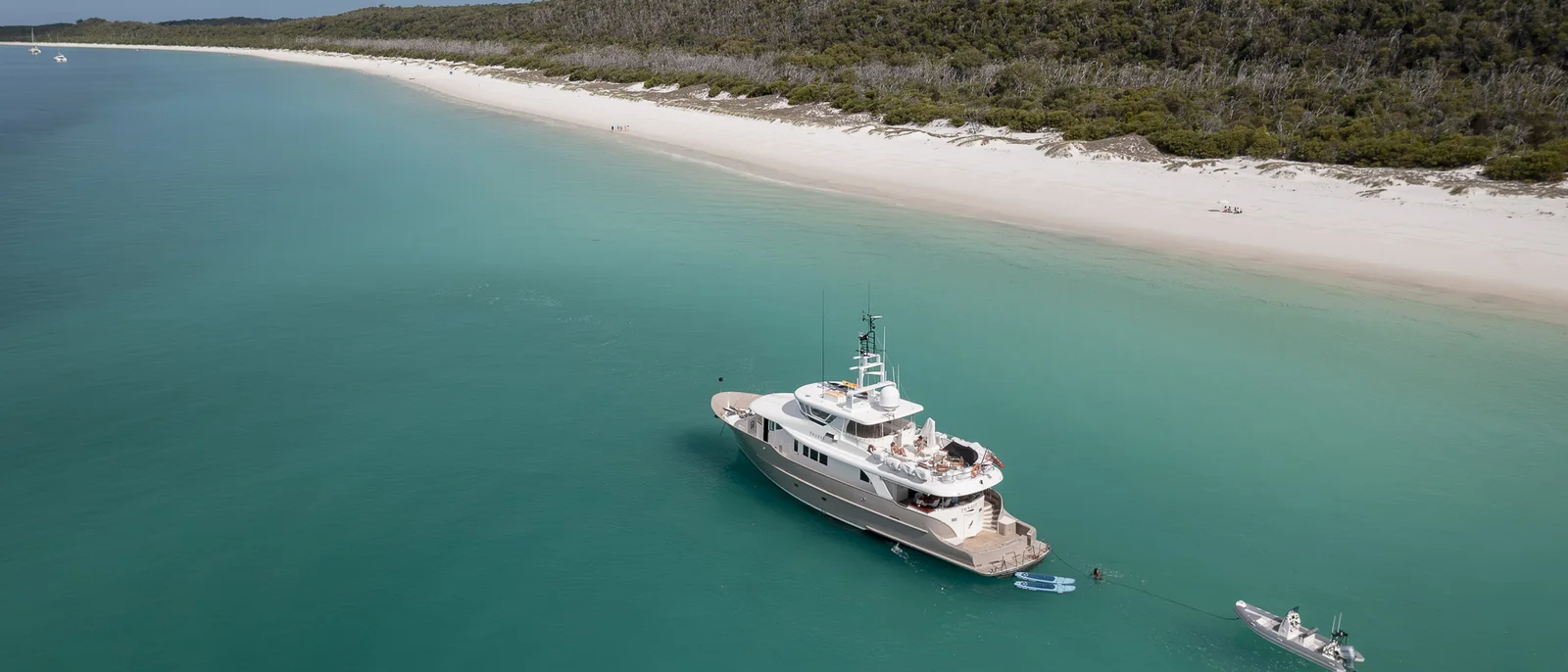 Texas T motor yacht anchored off Whitehaven Beach