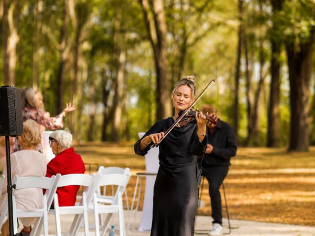 Live violinist performing during an outdoor wedding ceremony at Adeline Estate, a private Hunter Valley venue
