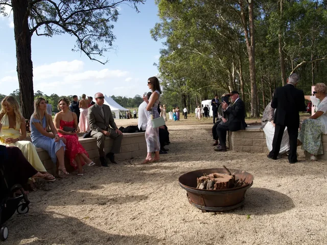 Guests gathering around the fire pit at Adeline Estate