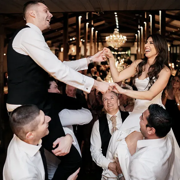 Melbourne Entertainment Company: groom lifted up on the dance floor