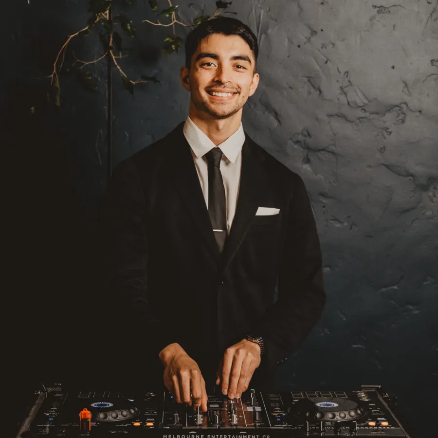 Melbourne Entertainment Company: DJ mixing in a suit