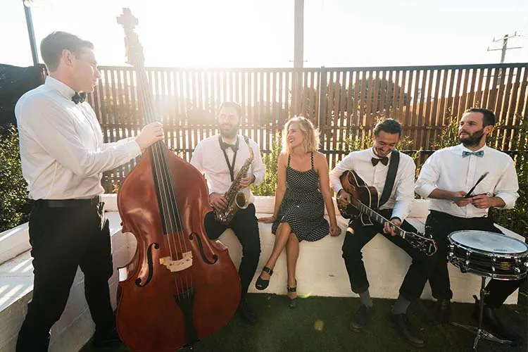 Melbourne Entertainment Company: band playing at a sunset event