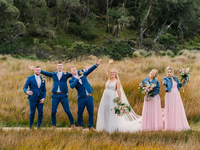 A Shot Above The Rest Photography: Bridal party celebrate in a field of tall grass