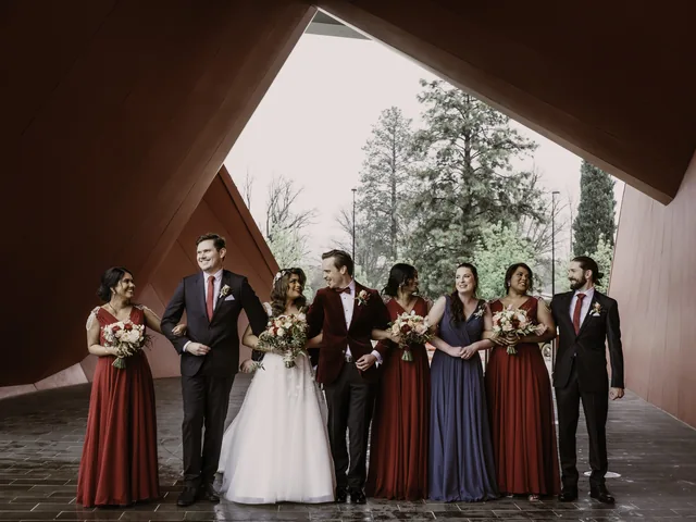 A Shot Above The Rest Photography: Bridal party beneath a sculptural timber canopy