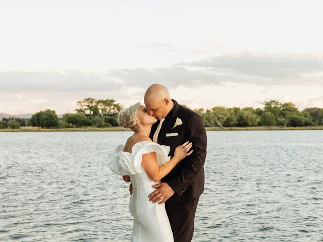 A Shot Above The Rest Photography: Couple embrace at the end of a lakeside jetty