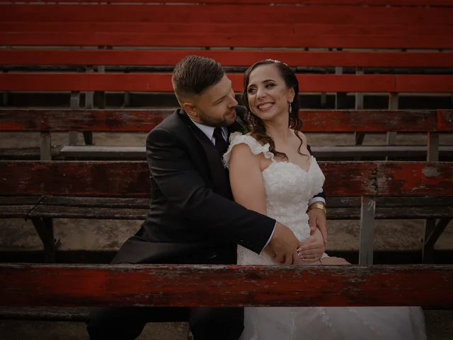 ATEIA Photography & Video: Couple seated together in a wedding portrait