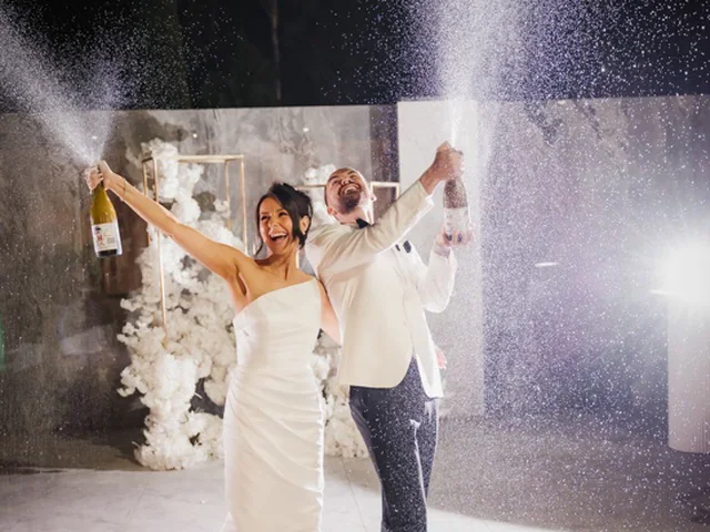 ATEIA Photography & Video: Bride and groom celebrate as champagne sprays across the dance floor