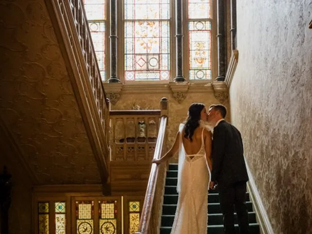 ATEIA Photography & Video: Couple at the foot of a grand timber staircase