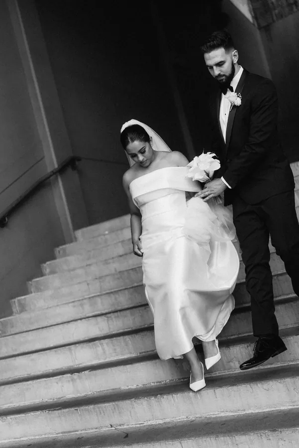 Fable Weddings: Black and white portrait of the couple on a staircase