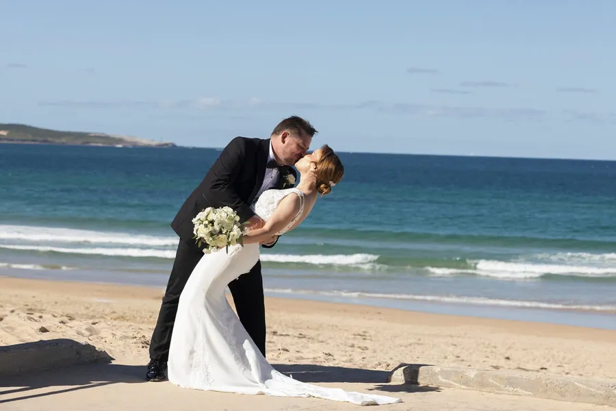 A Celebration Day: couple kissing on Cronulla Beach