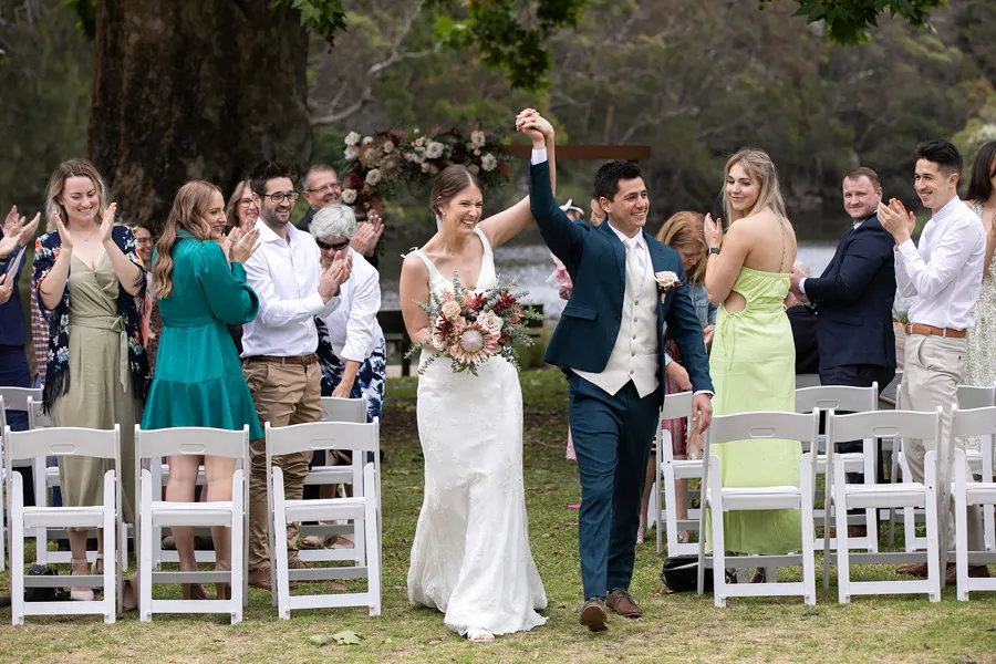 A Celebration Day: newlyweds celebrating with their guests after the ceremony