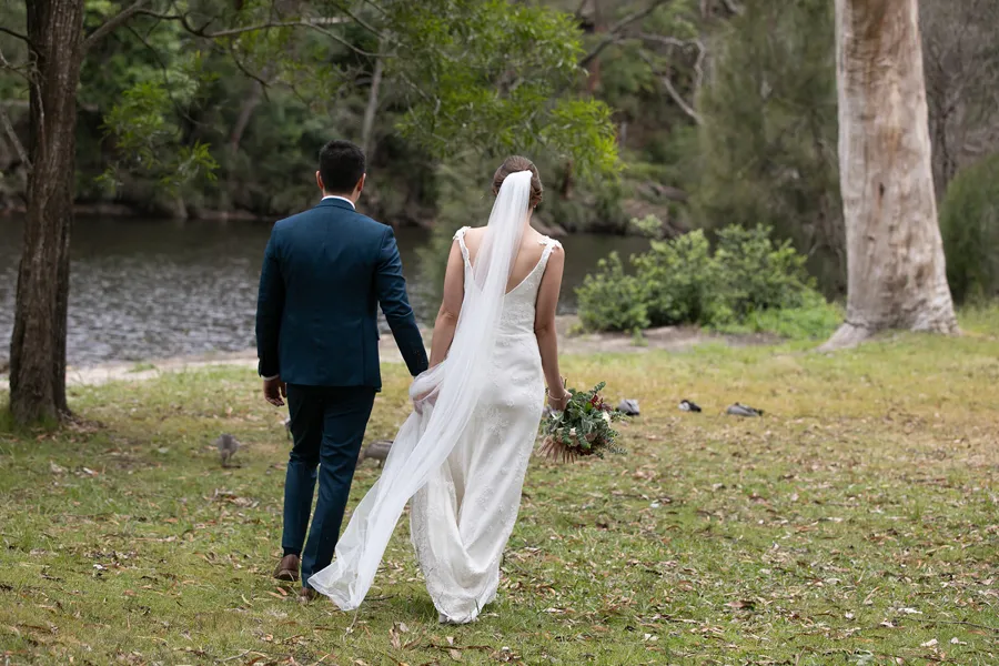 A Celebration Day: couple walking towards the water
