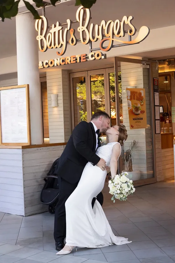A Celebration Day: a playful kiss outside the burger bar