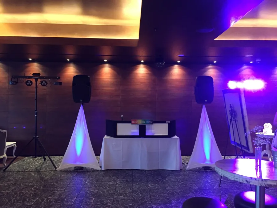 Wedding DJ Hire: DJ booth with uplit speaker stands